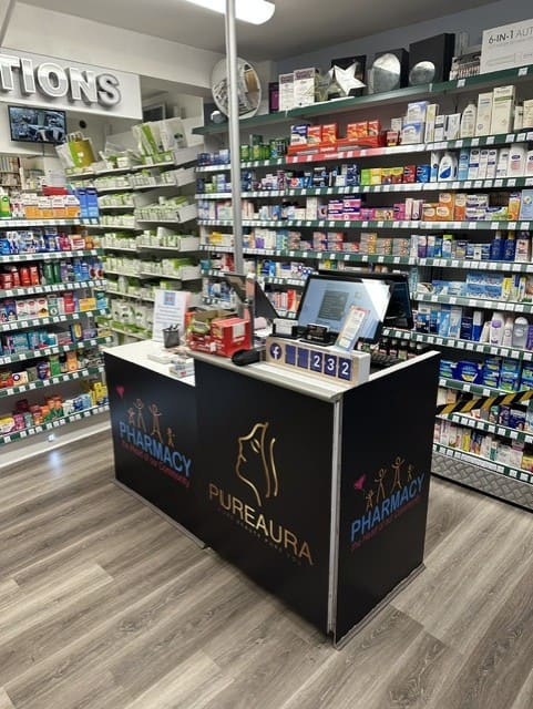 Inside Cadbury Heath Pharmacy - shop floor and PureAura counter